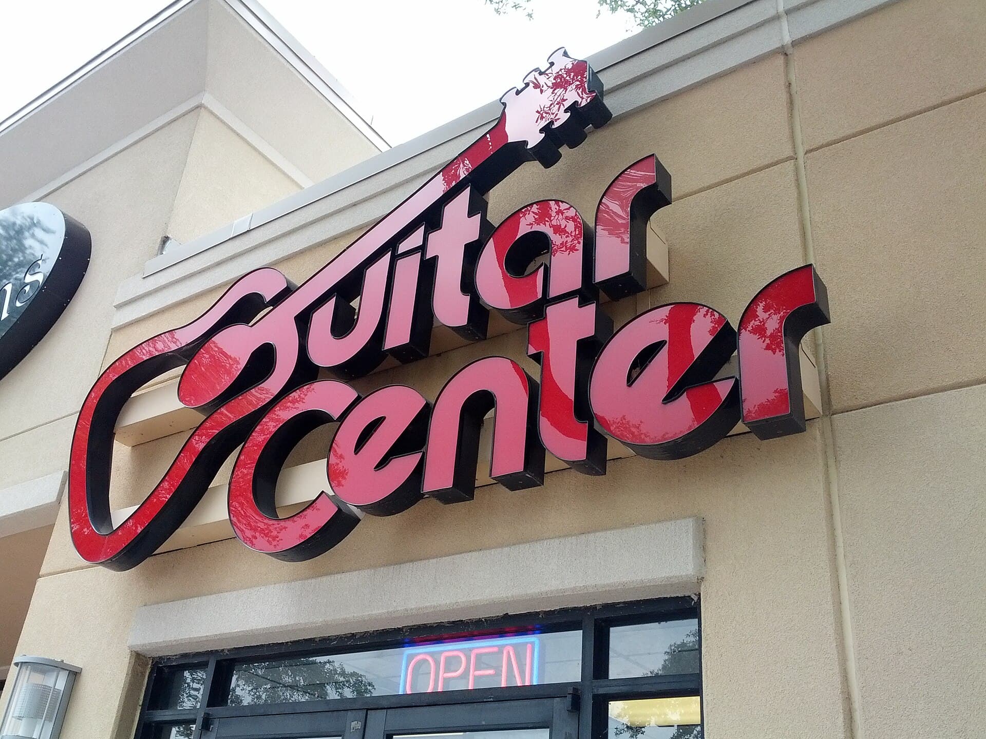 Guitar Center sign on Burnet Road in Allandale, Austin